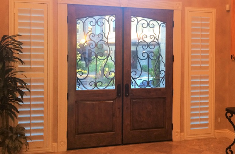 Sidelight window shutters in Southern California foyer